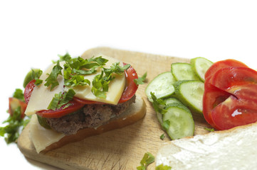 Homemade meat and cheese sandwich preparation
