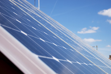 Alternative energy photovoltaic solar panels on roof of residential house