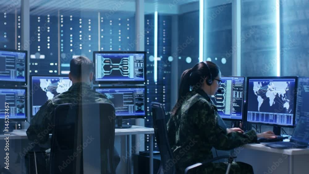 Aufkleber Male and Female Military IT Technicians Working on Computers with Multiple Displays Showing Various Information. Possible Surveillance, Army Maneuvers. Shot on RED EPIC-W 8K Helium Cinema Camera.