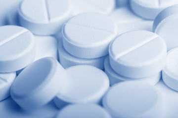 Heap of white pills. Medical product background