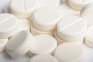 Heap of white pills. Medical product background