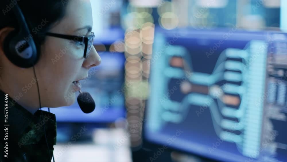 Aufkleber close-up of female military technical support professional gives instructions into headset. she's in