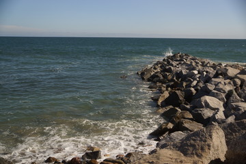 Fototapeta na wymiar Ocean hitting a rocky shore