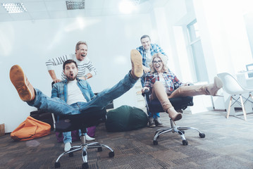 Low angle of cheerful office workers having fun