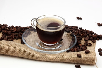 Coffee cup and beans on a white background.