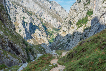 The Canal del Texu is a hiking trail and a passage way between the village Bulnes and Poncebos at the river Rio Cares. The trackway leads along the river Rio Bulnes, at the foot of the Picos de Europa