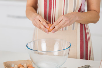 mature woman cooking tart for her family