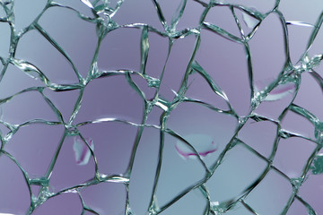 Macro shot of broken shattered window glass abstract background. 