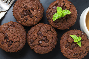 chocolate muffin with mint on a wooden table