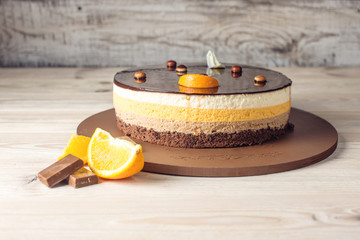 Orange chocolate cake with layers of delicate souffle, homemade dessert