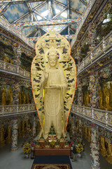 Interior of the temple and Quan Am Bodhisattva statue. Dalat. Vietnam