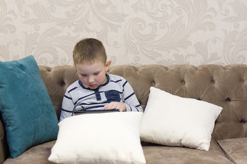 boy sitting on the couch