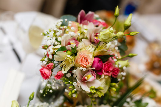 elegant wedding bouquet on table at restaurant