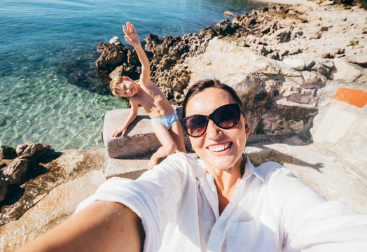 Mother with son take vacation selfie photo in Adriatic Sea Bay