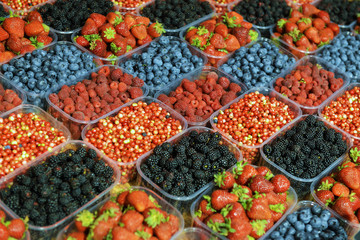 ripe berries in a plastic container in the store