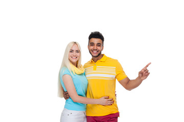 Beautiful Young Happy Couple Love Smiling Embracing, Hispanic Man Woman Point Finger To Empty Copy Space Isolated Over White Background