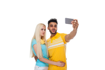 Beautiful Young Happy Couple Love Smiling Embracing Taking Selfie Photo On Cell Smart Phone, Hispanic Man Woman Isolated Over White Background