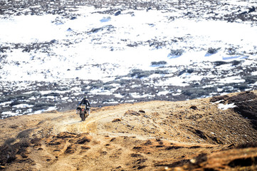 Motorcycle Running up the mountain snow.