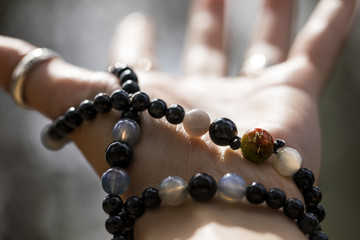 Woman's hand with a mala bracelet  - 145781419