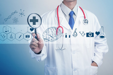 Medicine doctor hand holding stethoscope and working with modern medical icons