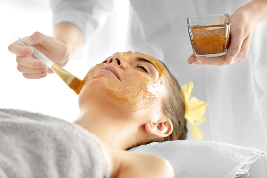 Beautiful Young Woman Getting Scrub Mask In Spa Salon, Close Up View