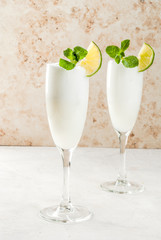 Italian summer alcoholic cocktail Sgroppino  - from ice cream, vodka and wine. Two servings in glasses. On a light background. Copy space