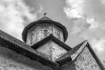 Tower of old orthodox monastery with a cross, Serbia, Balkans