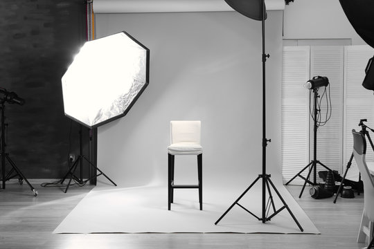 Modern photo studio with professional lighting equipment