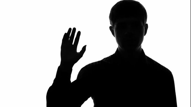 Silhouette video of a man by fingers counting from one to five