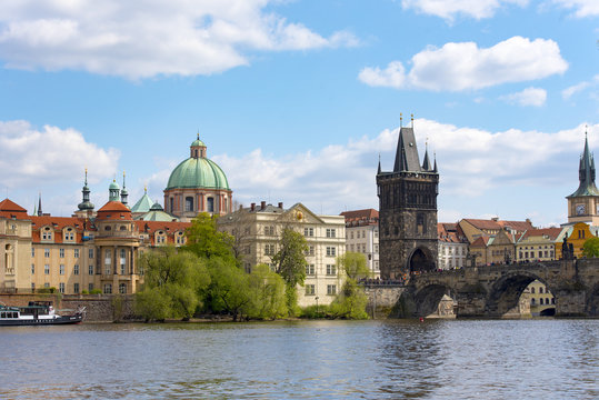 Charles Bridge over Vltava river and Old town in Prague