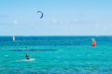 Professional kiter makes the difficult trick on a beautiful background, Mauritius