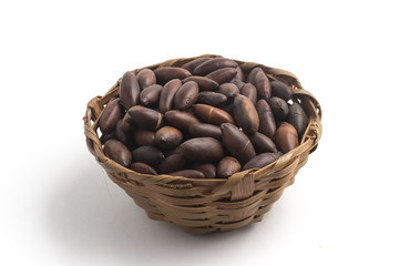 Brazilian Castanha de Baru Nut into a basket