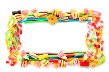 Frame made of colorful jelly candies on white background