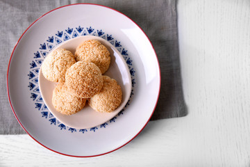 Tasty coconut cookies on ornate plate