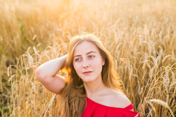 Bright Portrait of Happy Young Woman at Summer Field