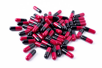 pile of medical pills and pills on white background.