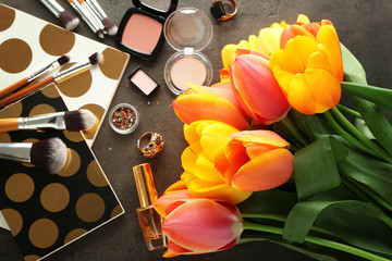 Naklejka na ściany i meble Beautiful composition of cosmetics with tulips on table