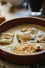 Delicious raviolis with gratin cheese, in restaurant