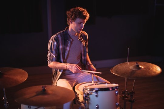 Drummer playing on drum set