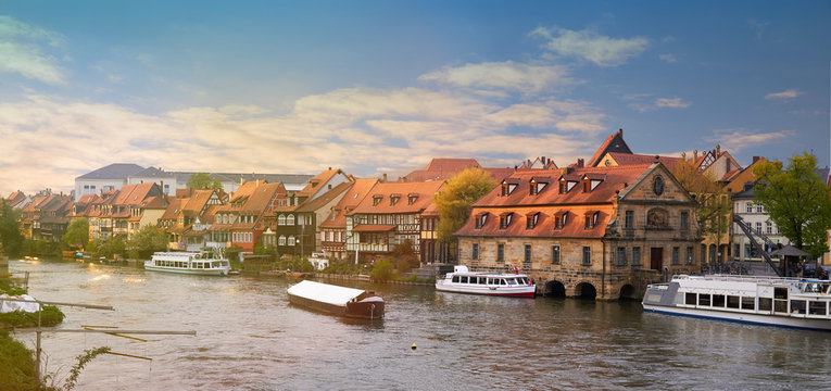 Scenic summer panorama warm toned at sunset of the Old Town pier in Bamberg, Bavaria, Germany. Panorama.