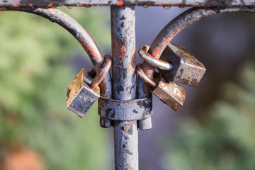 Locks on the fence of the bridge. Lovers lock their love with the lock.