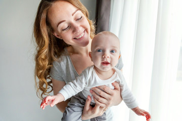 Young mother holding her newborn child