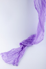 flowing drape soft purple fabric on white background. Vertical photo