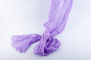 soft draped semitransparent purple fabric flowing on white background