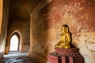 Golden Buddha statue and big Buddha mural inside the Sulamani temple in Bagan, Myanmar (Burma).