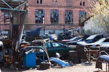 Naklejka premium abandoned dump of broken cars, spare parts, wheels