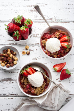 Breakfast bowls with frozen banana, raspberries, cocoa powder, nuts and coconut