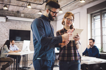 Company coworkers working in office
