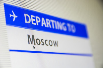 Computer screen close-up of status of flight departing to Moscow, Russia
