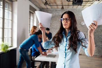 Overworked stressful businesswoman in office